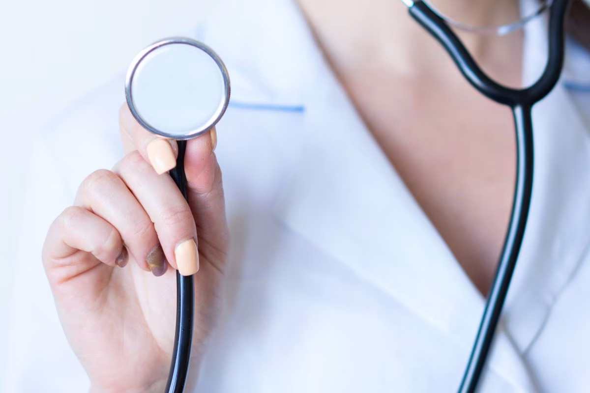 Doctor holding stethoscope, representing private healthcare sector from Stockmark.it