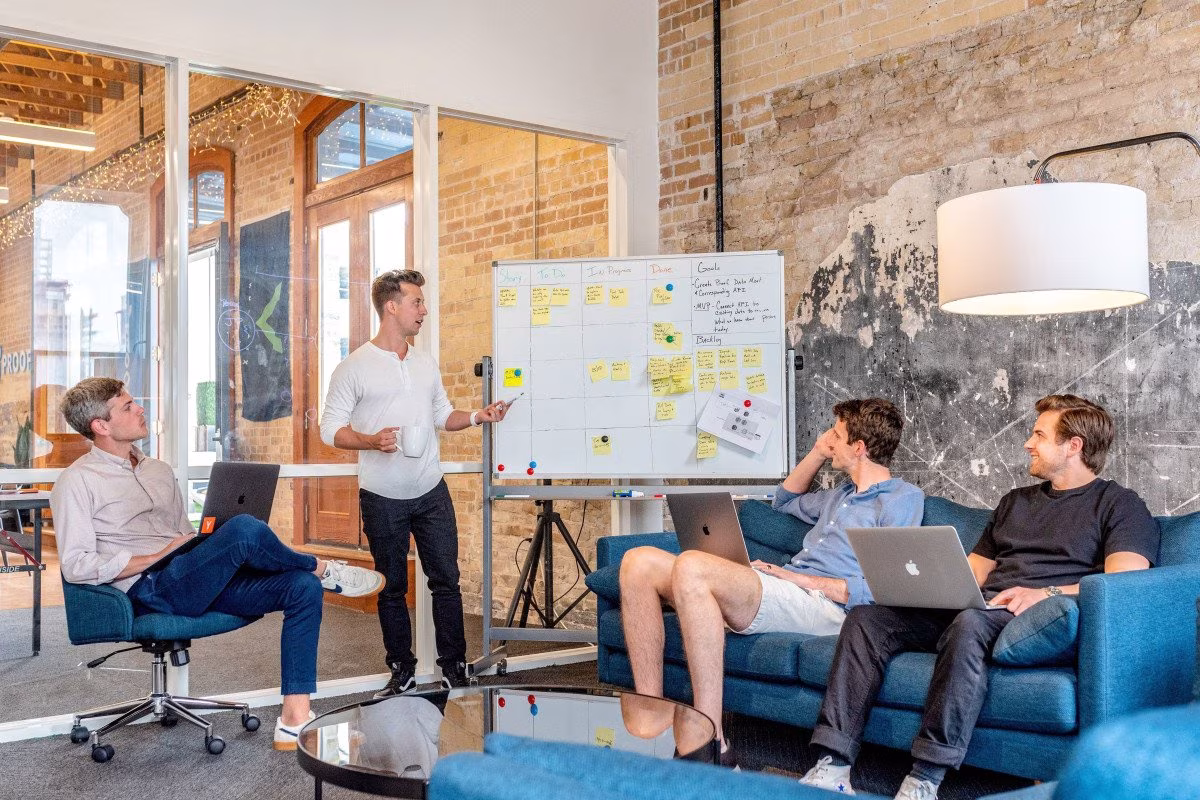 Team collaborating on AI in banking strategy with whiteboard from Stockmark.it