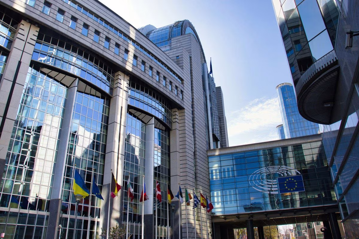 European Parliament building, Brussels, with flags including EU and Ukraine from Stockmark.it