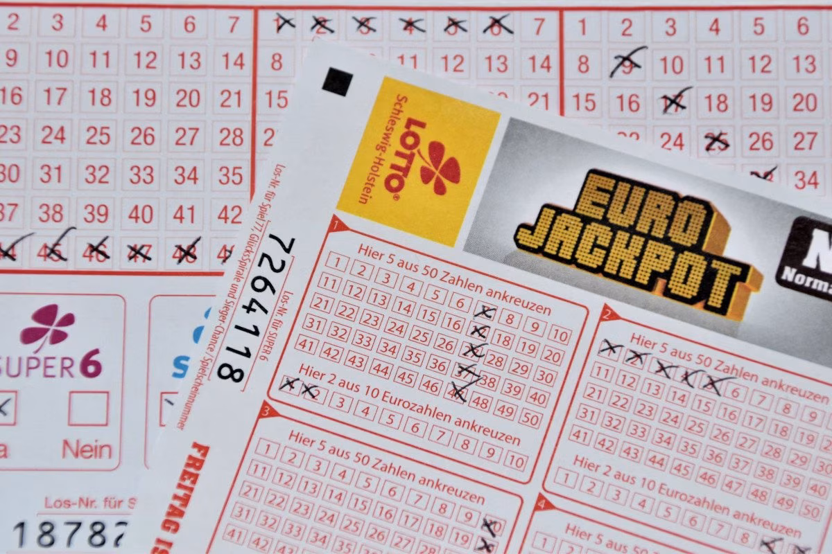 Lottery tickets including Eurojackpot and Super 6 with numbers marked. from Stockmark.it