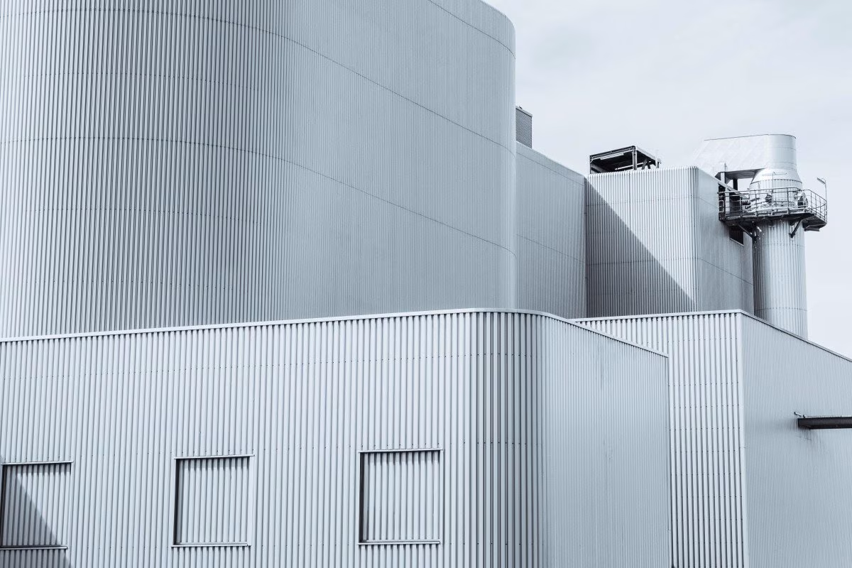 Modern industrial building with corrugated metal siding, part of Britain's energy sector. from Stockmark.it