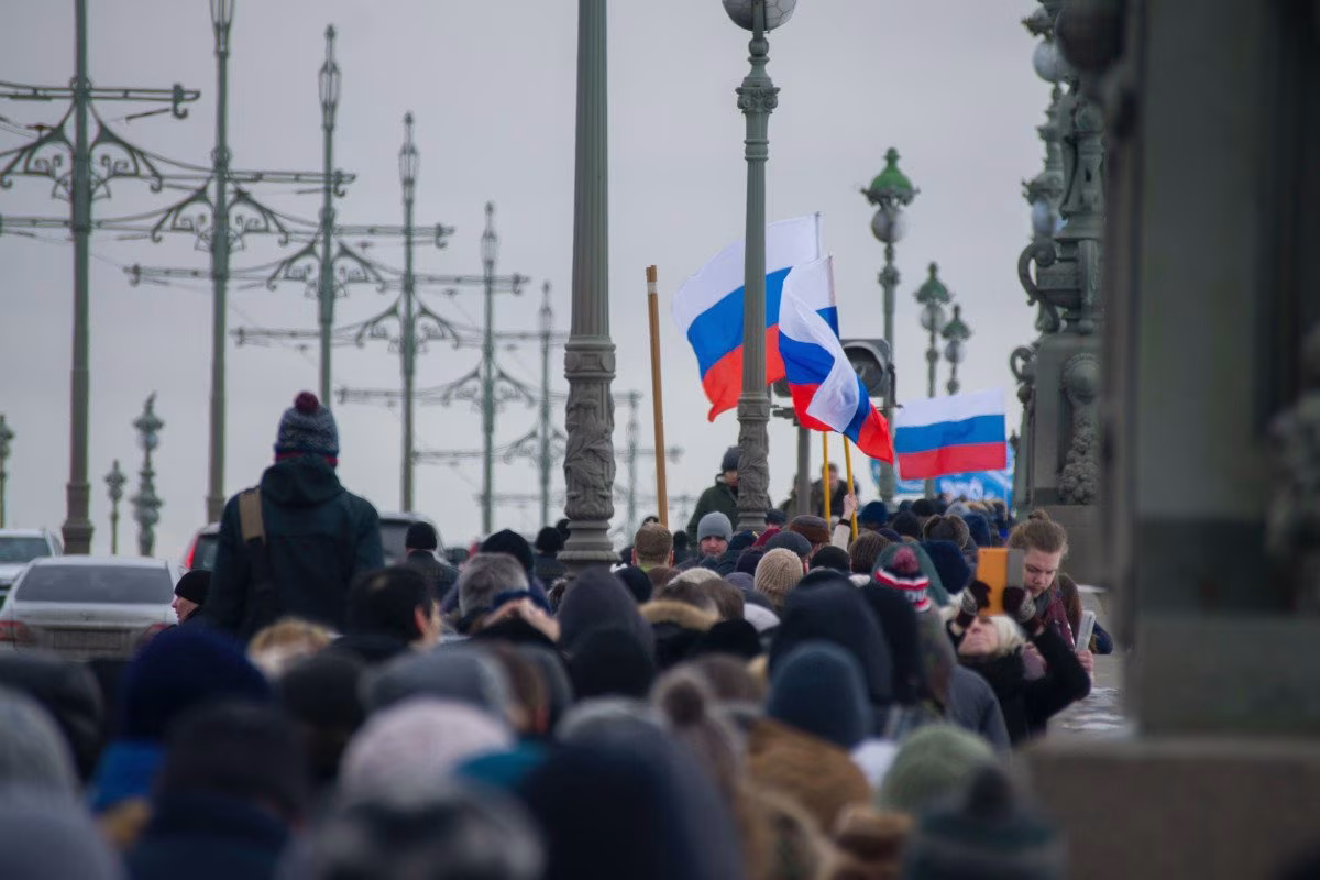 Russian flags displayed at a protest, as half a million Russians face bankruptcy. from Stockmark.it